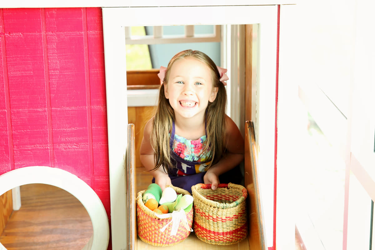 A happy visitor in the playhouse